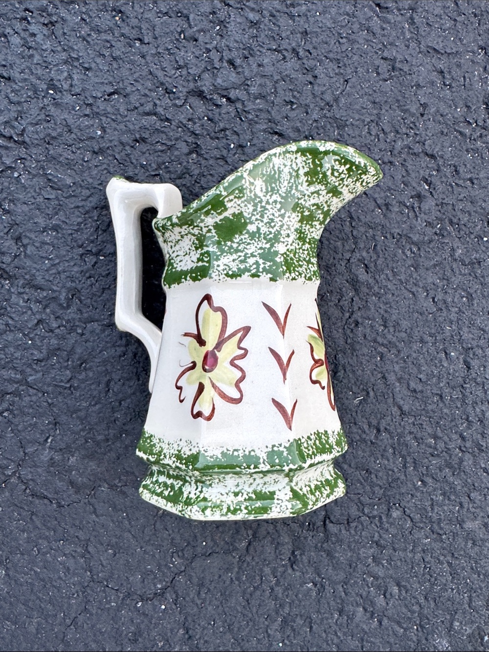 Vintage milk pitcher by the Cash family. Green sponge are folk art